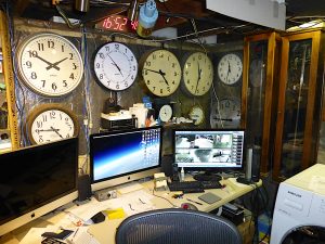 Clocks everywhere in mission control in the basement