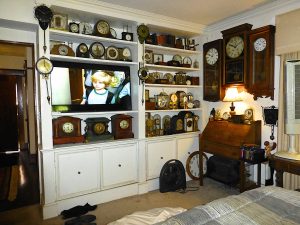 A wall of clocks. Most by various electric makers