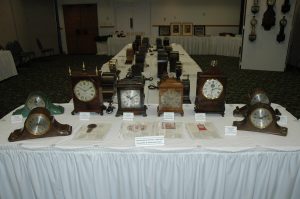 Sangamo Early American Reproduction clocks and examples of the Sangamo Gorham bronze clocks, all with 11 - jewel escapements and electrically wound movements.