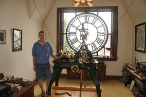 Durward standing next to the Seth Thomas No. 16A gravity escapement Tower Clock from 1909
