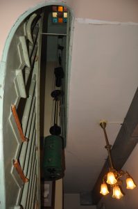 Weights on cables and pulleys descend down the stairwell to power the E. Howard and Seth Thomas tower clocks 